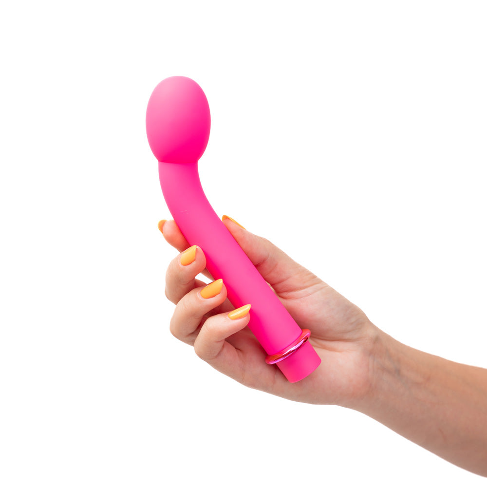 Maia KORA -  17.8 cm USB Rechargeable G-Spot Vibrator held in hand with a pink silicone design.
