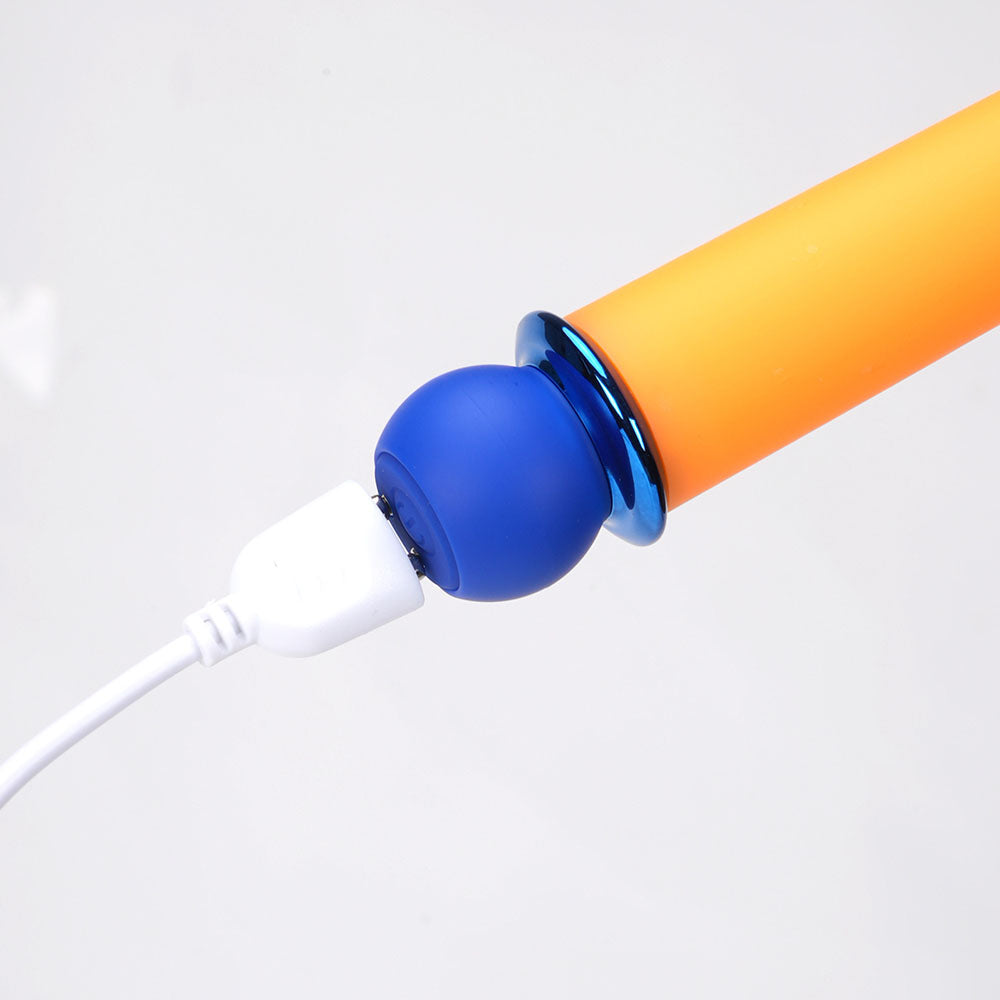 Maia RORI - Orange - Orange 15.2 cm USB Rechargeable XL Bullet charging with a white USB cable.