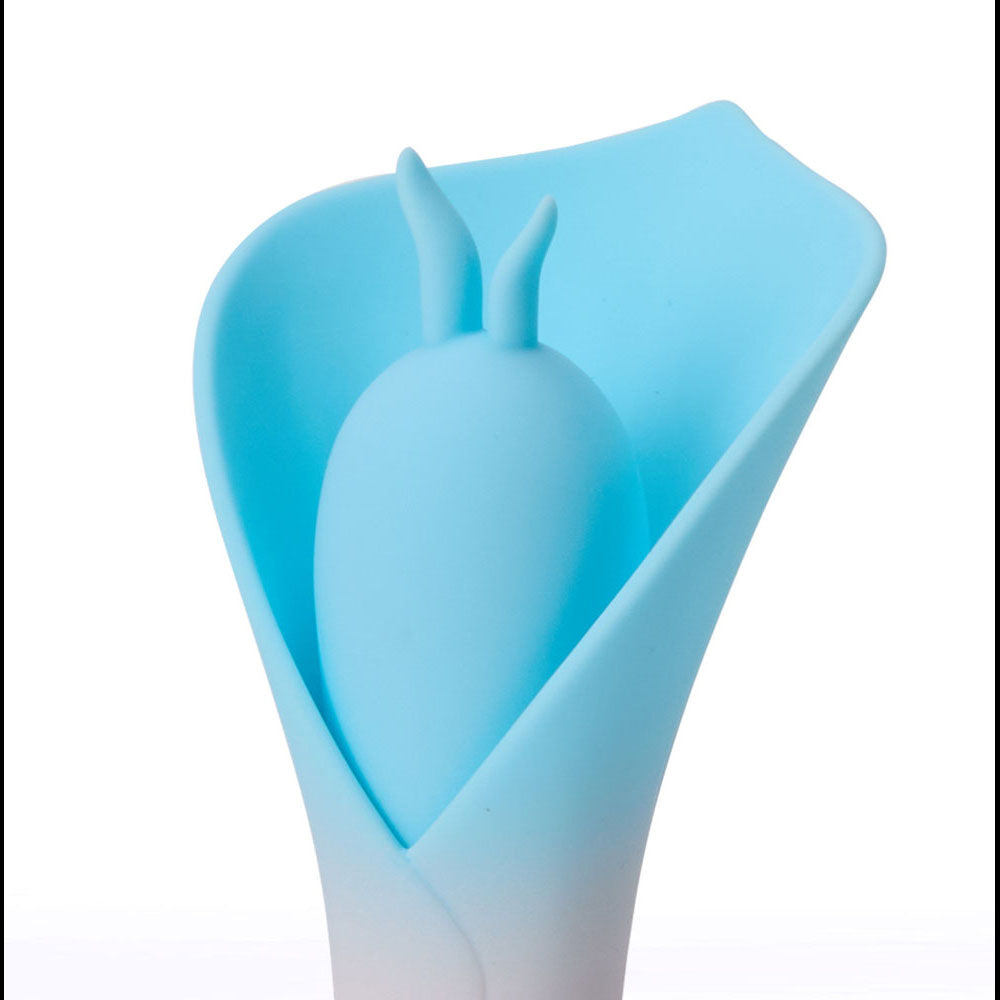 Maia MINA -  - /Pink USB Rechargeable Fluttering Flower Stimulator featuring a soft silicone design in blue.