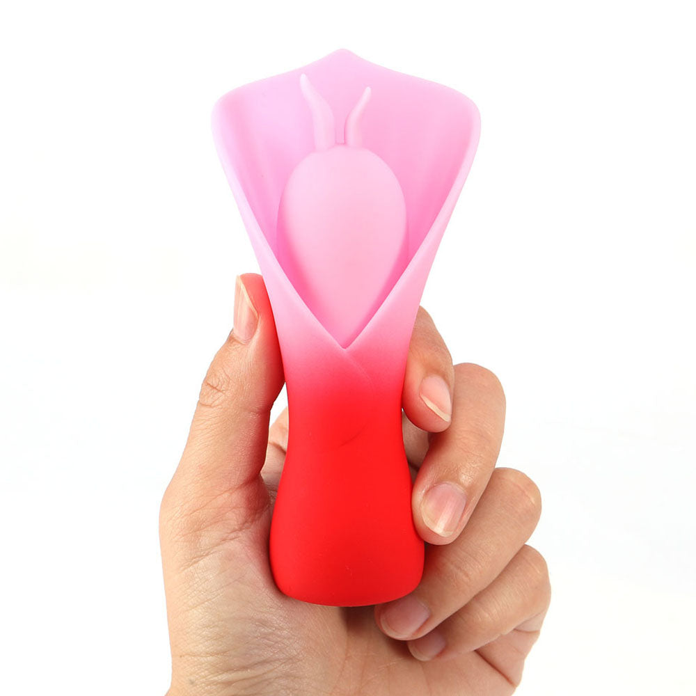Maia MINA -  - /Pink USB Rechargeable Fluttering Flower Stimulator held in hand, designed for intimate essentials for her.
