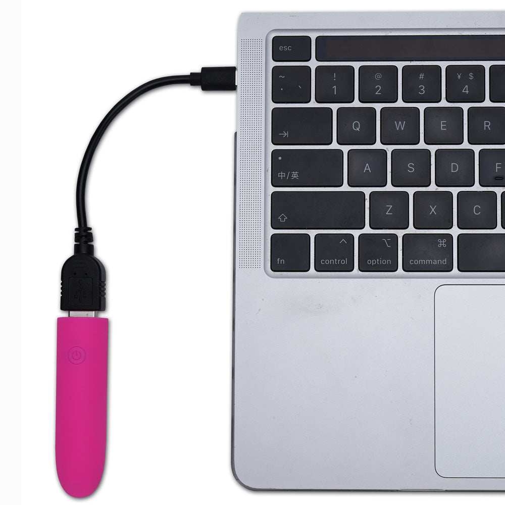 Maia VIBEDRIVE -  -  10 cm USB Rechargeable Bullet with 16 GB Storage connected to a laptop for charging.