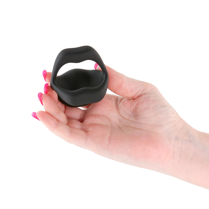 Techno - Strobe -  -  USB Rechargeable Vibrating Cock Ring with App Control held in hand, showcasing its design and size.