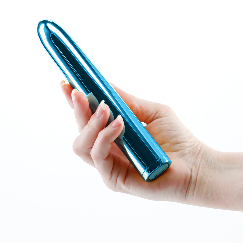Chroma - Teal - Metallic Teal 17 cm USB Rechargeable Vibrator held in hand, showcasing sleek design and color.