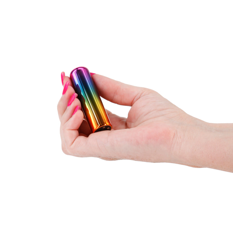 Chroma Rainbow - Small - Metallic Rainbow 6.8 cm USB Rechargeable Bullet held in hand, showcasing its vibrant colors.