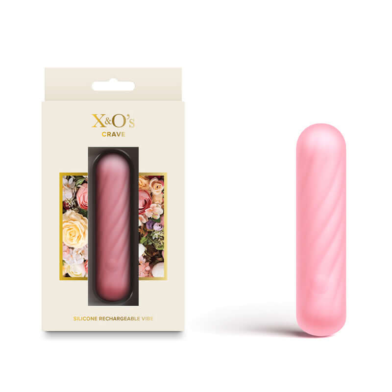 X & O's Crave light pink silicone USB rechargeable bullet vibrator package and product on display.
