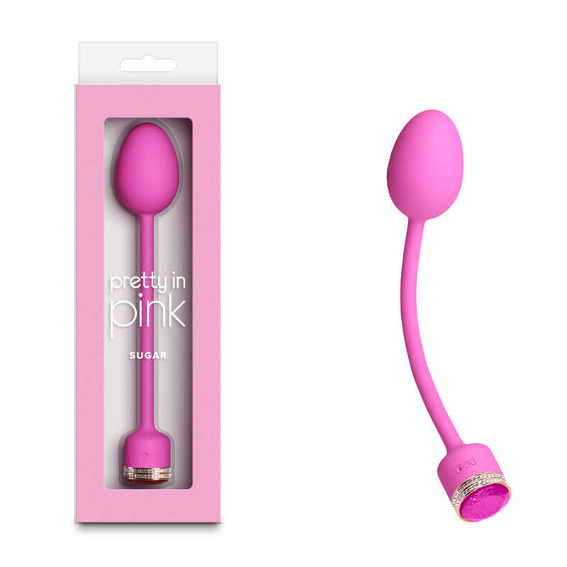 Pretty in Pink Sugar USB rechargeable vibrator with sleek design and jewel accents in packaging.