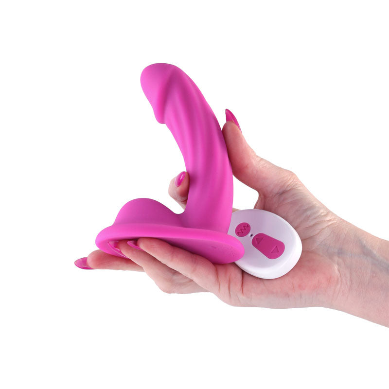 Colours Curve - Vibrating 5'' Dildo -  -  12.6 cm USB Rechargeable Vibrating Dildo with Wireless Remote held in hand.