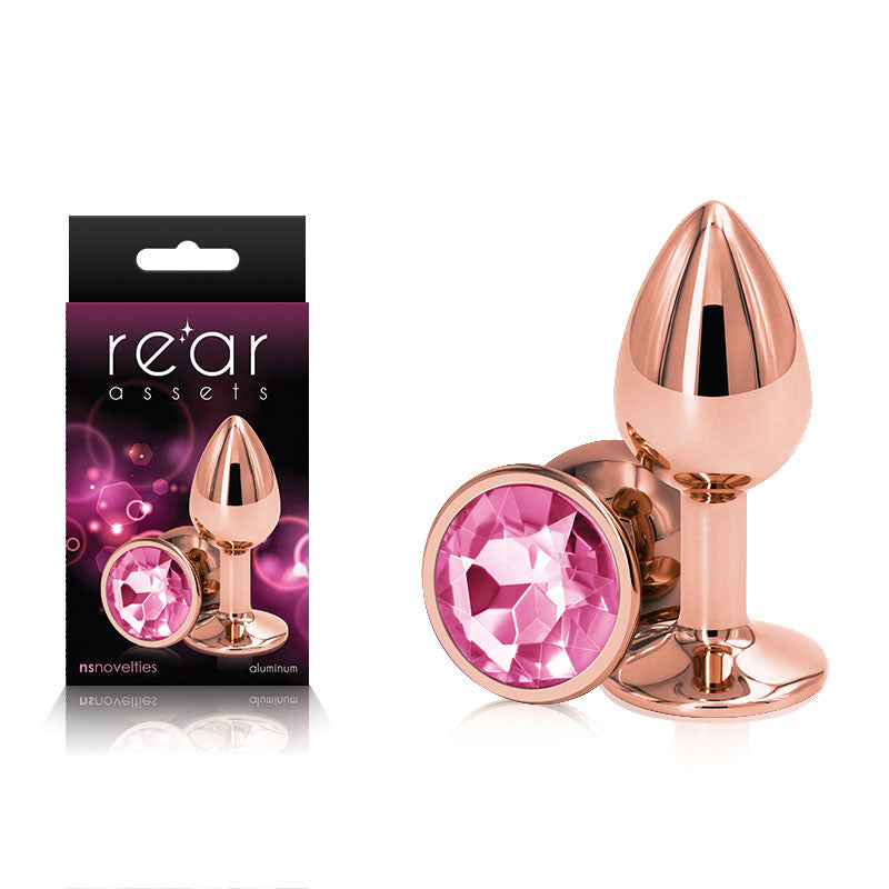 Rear Assets Rose Gold Small - Rose Gold Small Metal Butt Plug with Pink Gem Base next to packaging.
