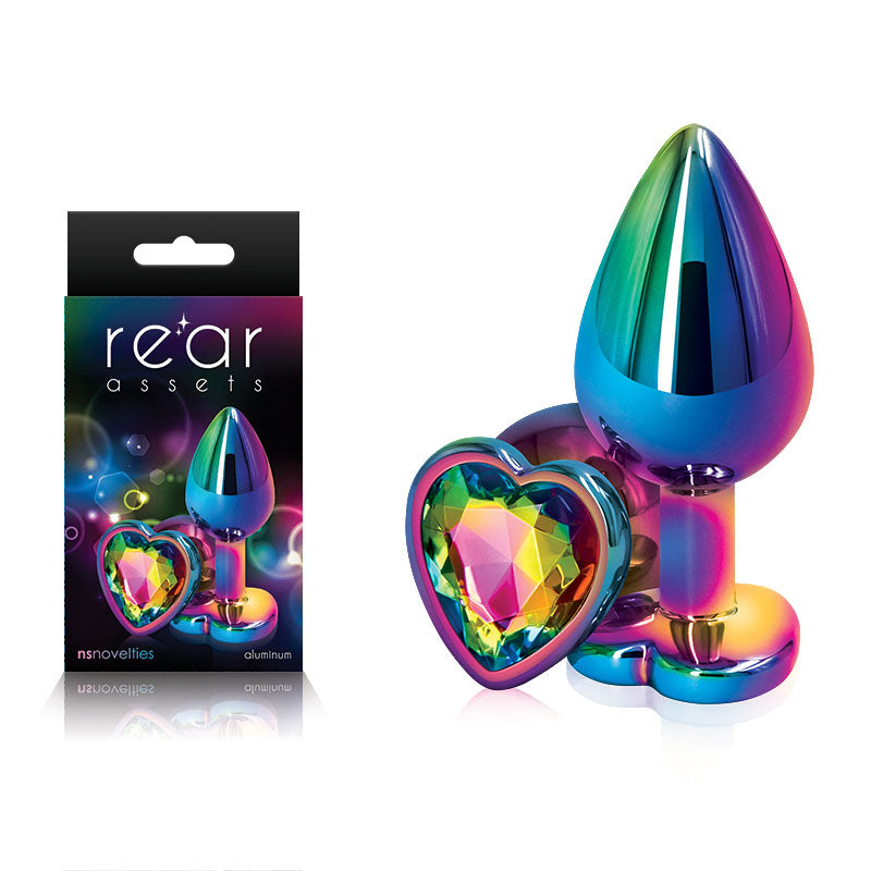 Rear Assets Multi  Heart - Multi  Medium Metal Butt Plug with Rainbow Heart Gem Base next to its packaging.