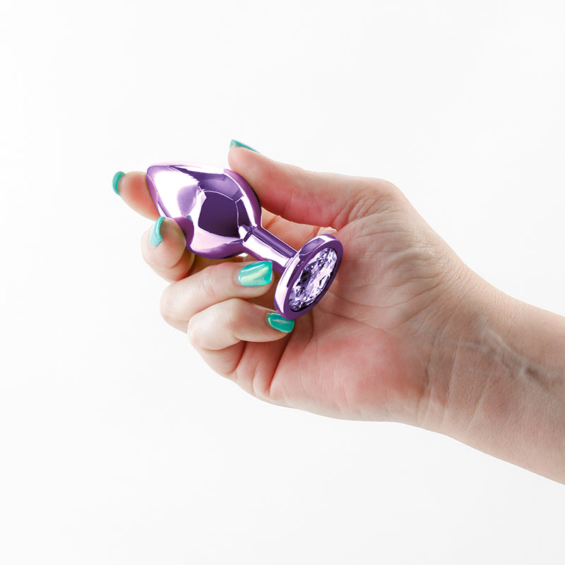 Rear Assets - Medium -  -  8.2 cm Medium Metal Butt Plug with  Round Gem Base held in a hand.