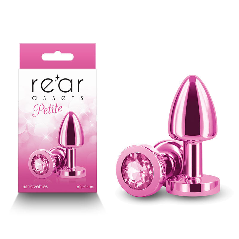 Rear Assets Petite -  -  6 cm Metal Butt Plug with  Round Gem Base displayed in packaging, featuring a shiny pink design.