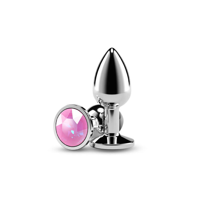 Small metal butt plug with pink gem, chrome-plated aluminum, lightweight anal toy for sensual excitement.