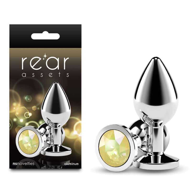 Rear Assets Silver aluminum butt plug with yellow gem base for sensual excitement and effortless penetration.