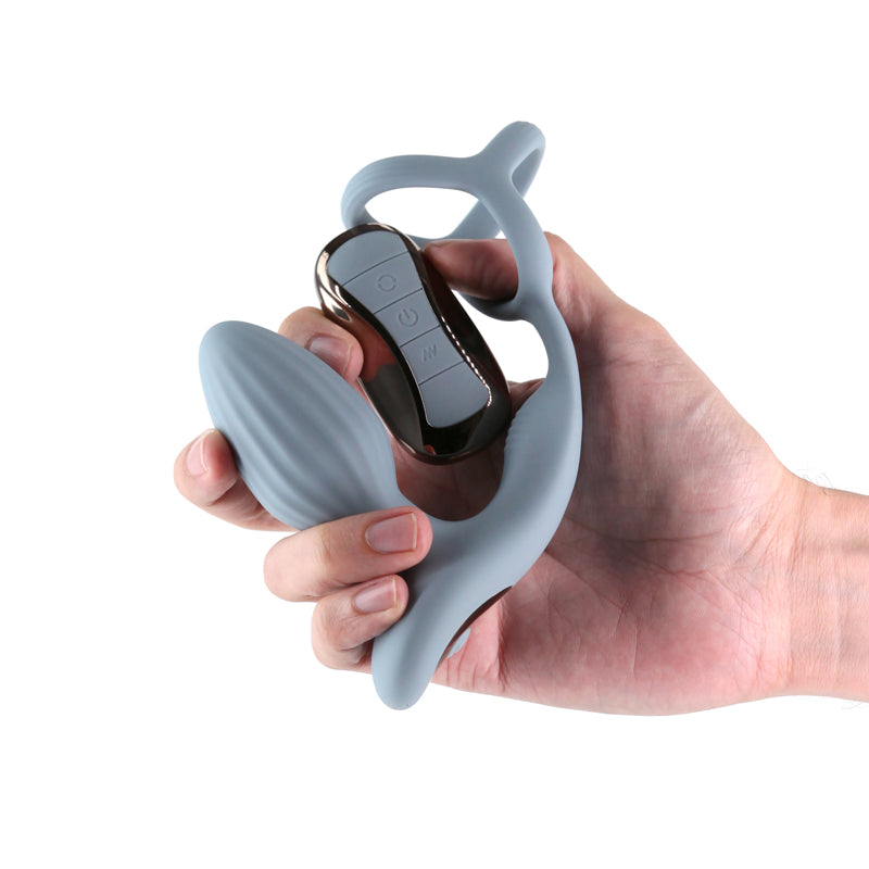 Renegade Pinnacle - Grey - Grey USB Rechargeable Vibrating Butt Plug with Cock Ring being held in hand
