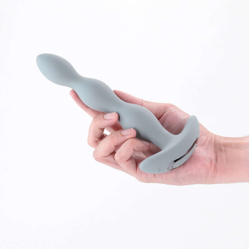 Renegade Vantage grey 20.6 cm USB rechargeable vibrating anal beads in hand for smooth stimulation.