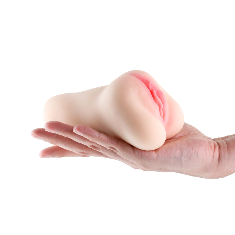 Barely Legal - Elle -  Vagina Stroker held in hand, showcasing its realistic design and intimate essentials for her.