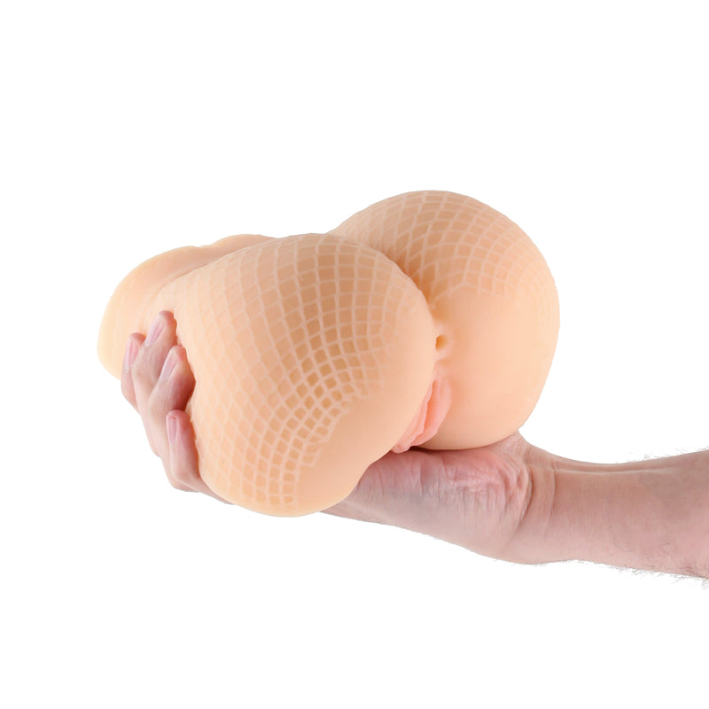 Barely Legal Leilani - Tan - Tan Mini Doggy Style Masturbator held in hand, showcasing its realistic texture and design.