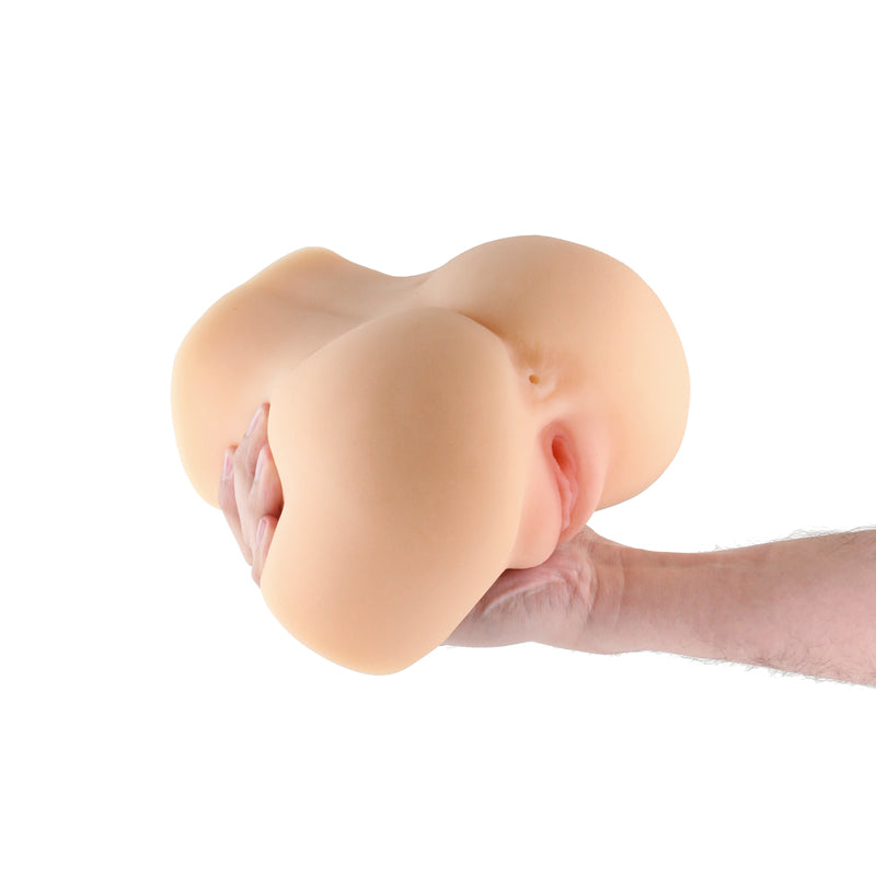 Barely Legal Lotus - Tan - Tan Mini Doggy Style Masturbator in a hand for intimate essentials.