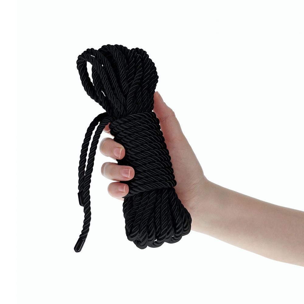 OUCH! Bondage Rope - 10 M -  -  Nylon Bondage Rope - 10 metre Length being held in a hand.