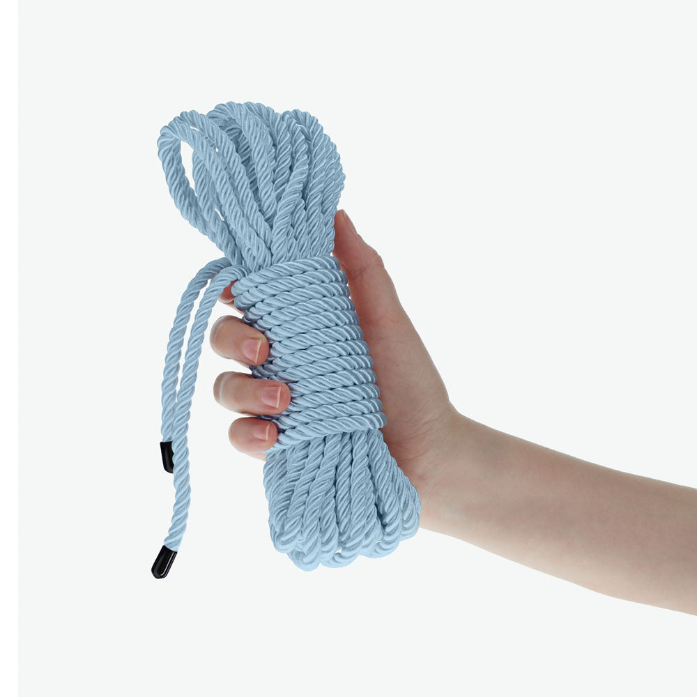 OUCH! Bondage Rope - 10 M - Powder  - Powder  Nylon Bondage Rope - 10 metre Length held in a hand.