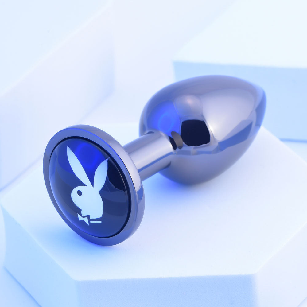 Playboy Pleasure TUX - Small - Metal 7.4 cm Small Butt Plug on a light background.