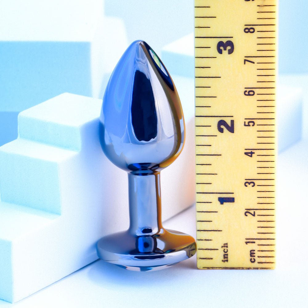 Playboy Pleasure TUX - Small - Metal 7.4 cm Small Butt Plug next to a ruler for size comparison.