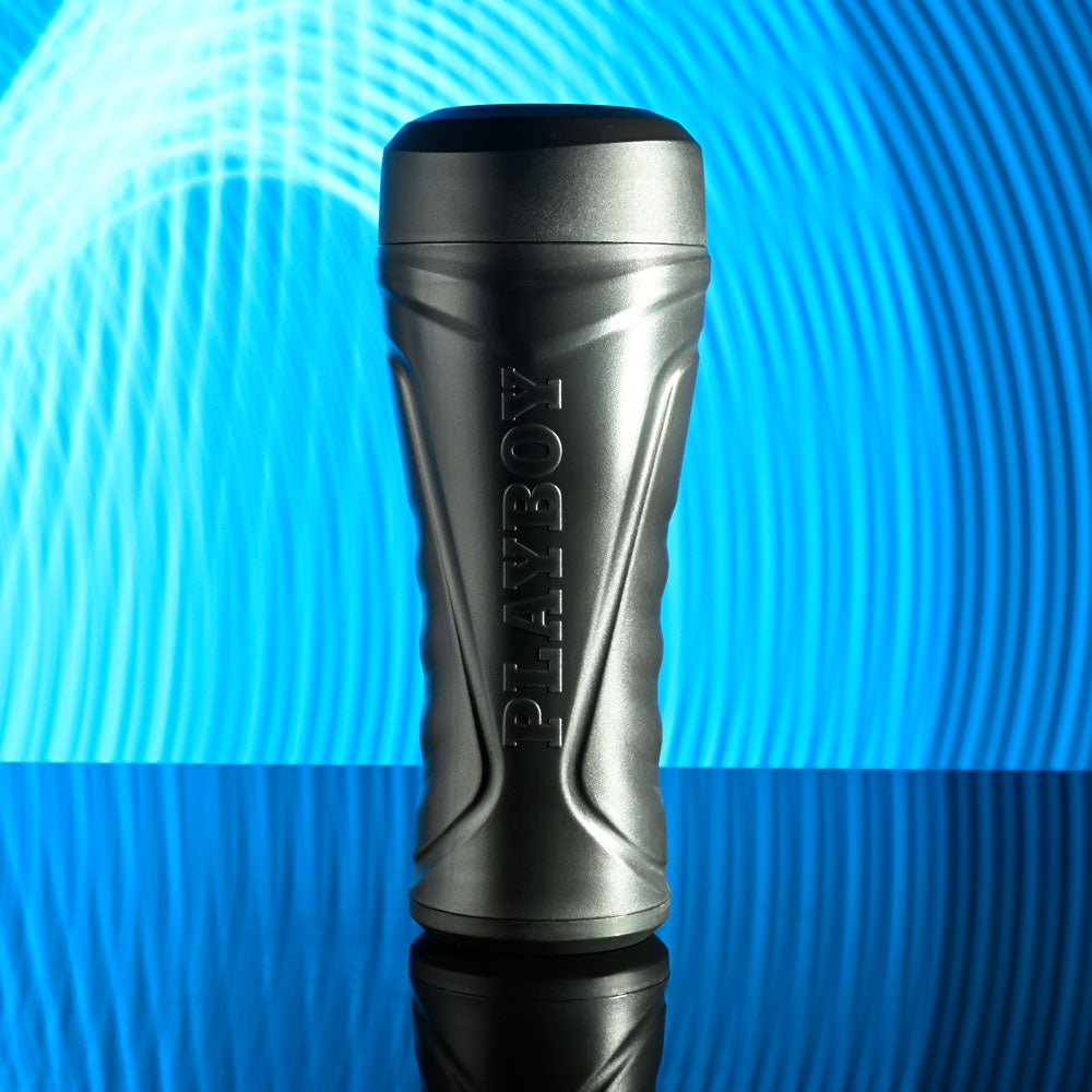 Playboy Pleasure THE URGE MEDIUM - Clear Stroker displayed against a blue wave background, perfect for intimate essentials.