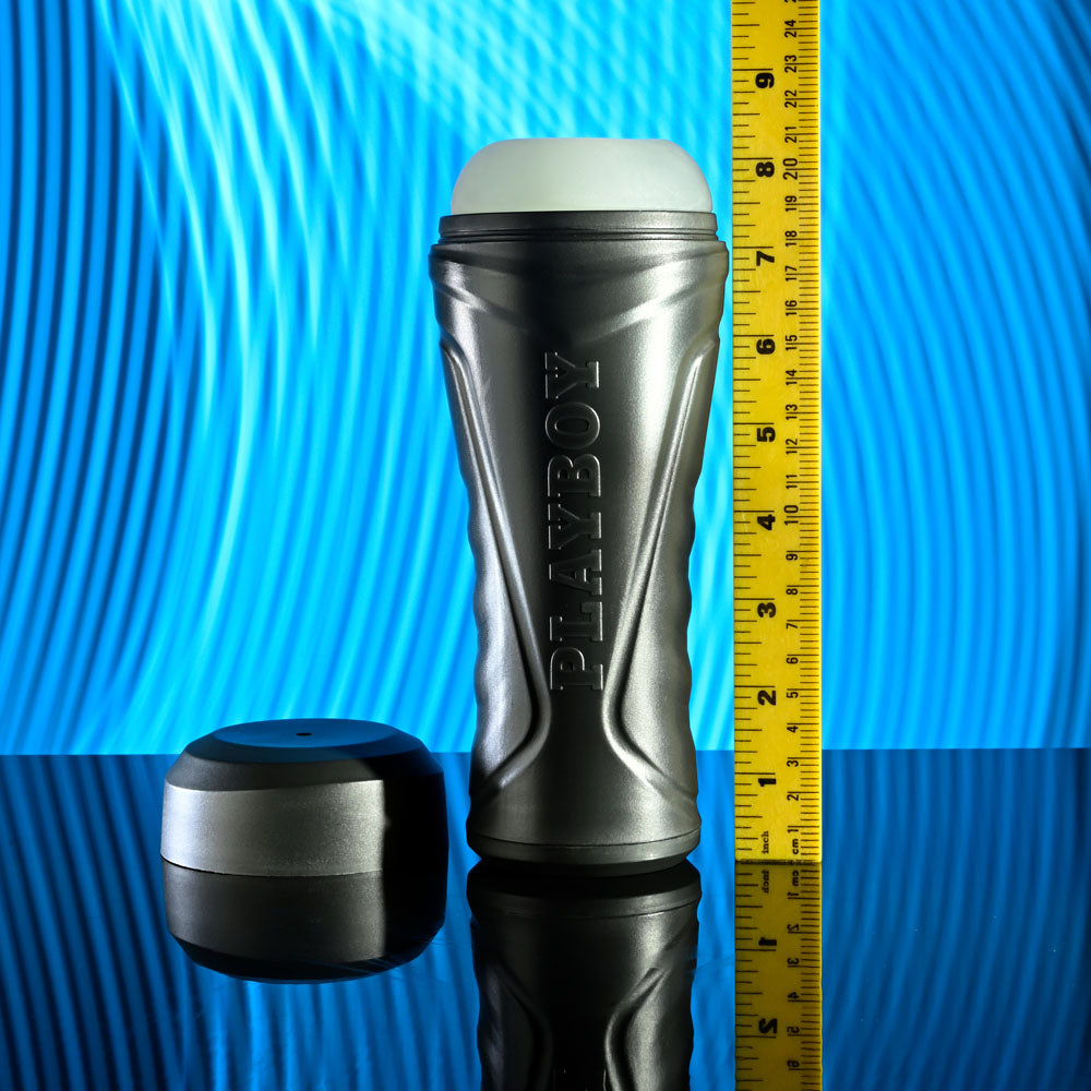 Playboy Pleasure THE URGE MEDIUM - Clear Stroker displayed with measuring tape against a blue background.