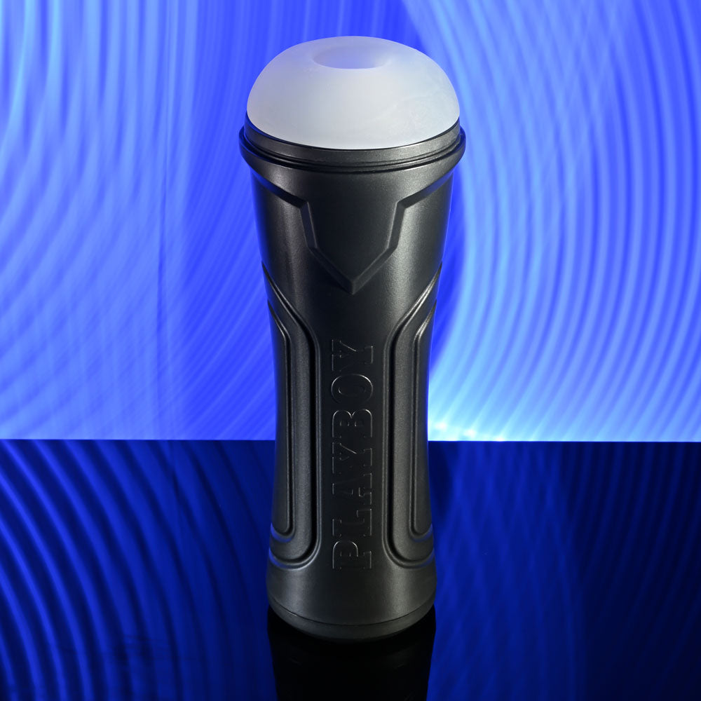 Playboy Pleasure THE URGE LARGE - Clear Stroker on a reflective surface against a blue background.