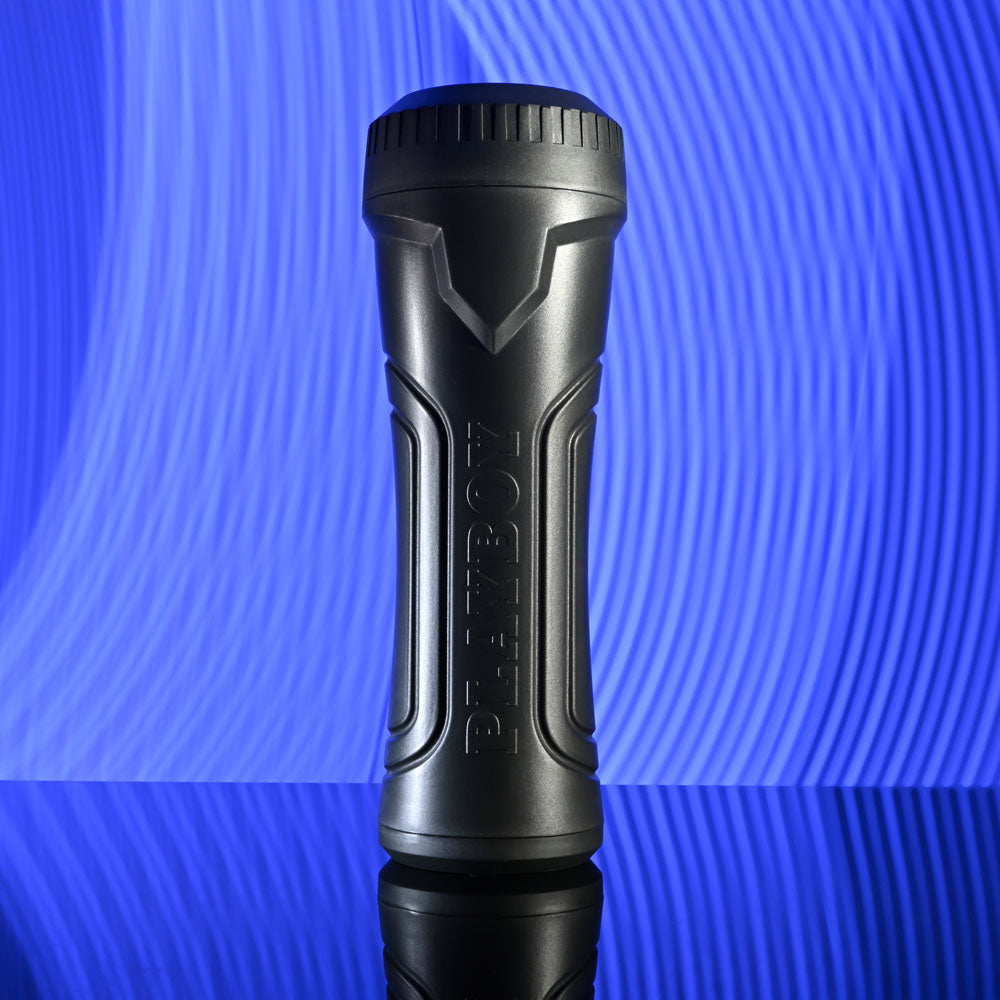 Playboy Pleasure THE URGE LARGE - Clear Stroker on reflective surface with blue background.