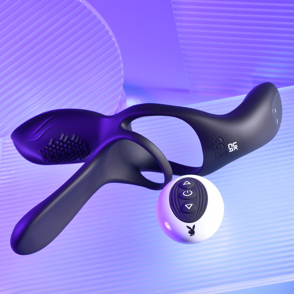 Playboy Pleasure The 3 Way - USB Rechargeable Vibrating Cock Ring with Wireless Remote on a colorful background.