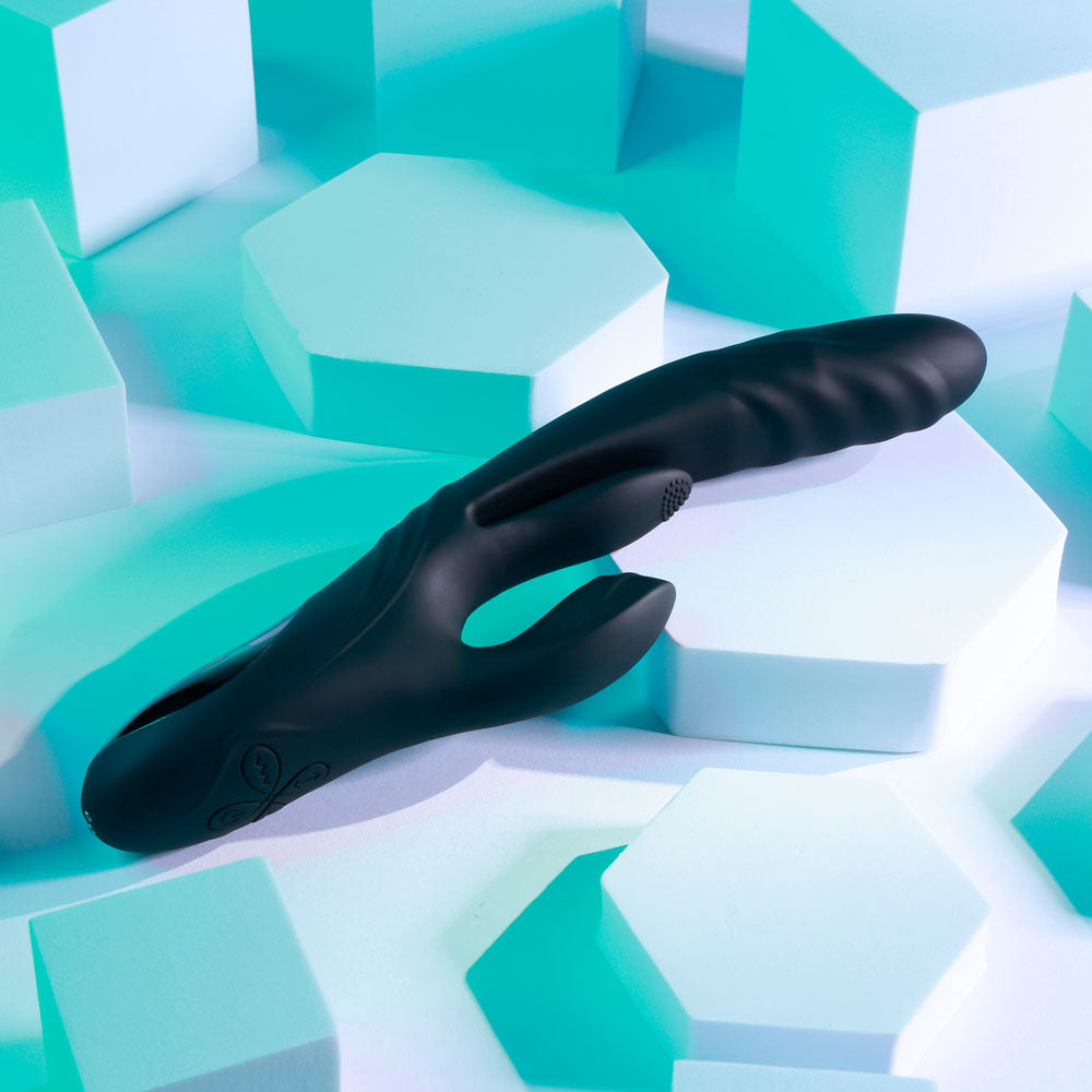 Playboy Pleasure RAPID RABBIT, a USB rechargeable rabbit vibrator, designed for pleasure with sleek black silicone.
