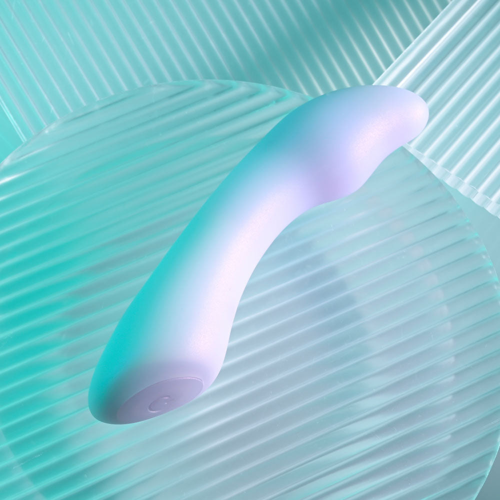 Playboy Pleasure EUPHORIA - Opal 12 cm USB Rechargeable Mini Vibrator on a textured surface, showcasing its design and color.