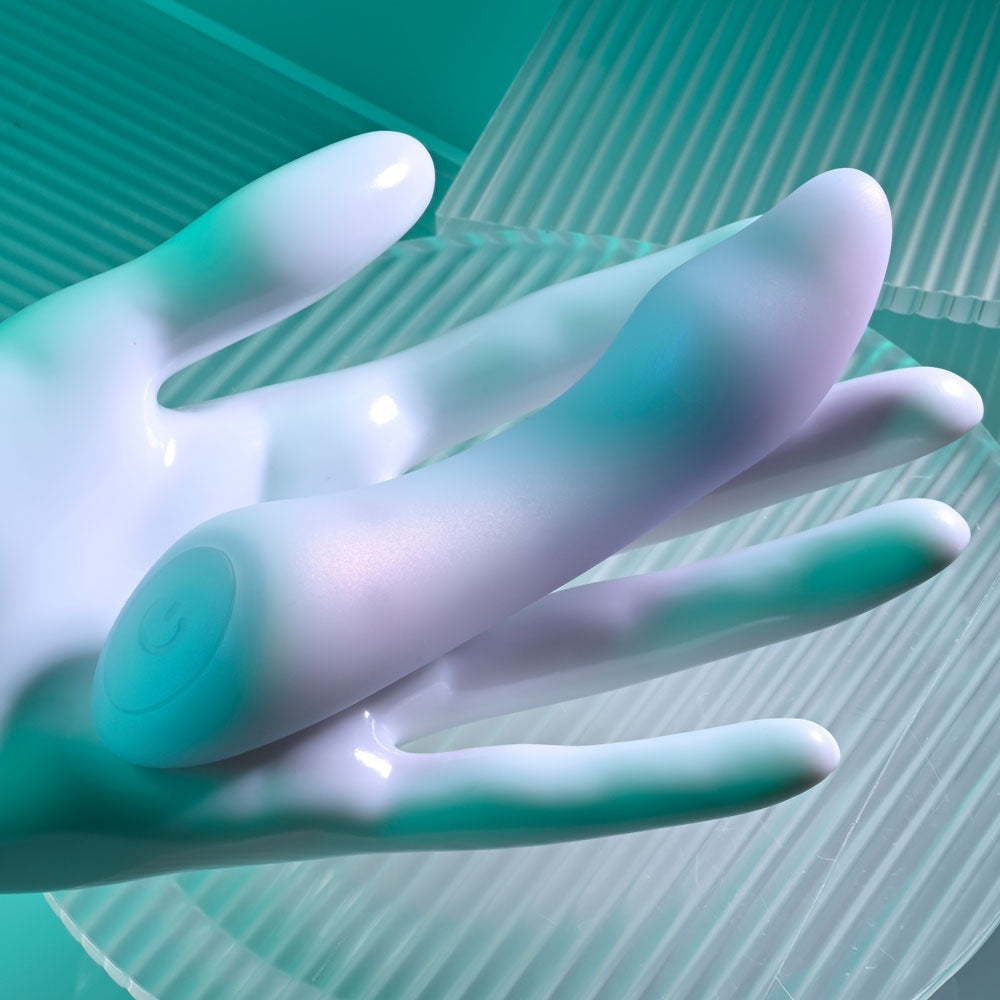 Playboy Pleasure EUPHORIA - Opal 12 cm USB Rechargeable Mini Vibrator resting on a hand, showcasing its sleek design.