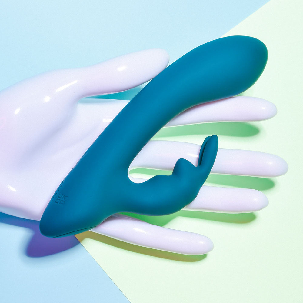 Playboy Pleasure LIL RABBIT - Deep Teal 14.6 cm USB Rechargeable Rabbit Vibrator on a hand.