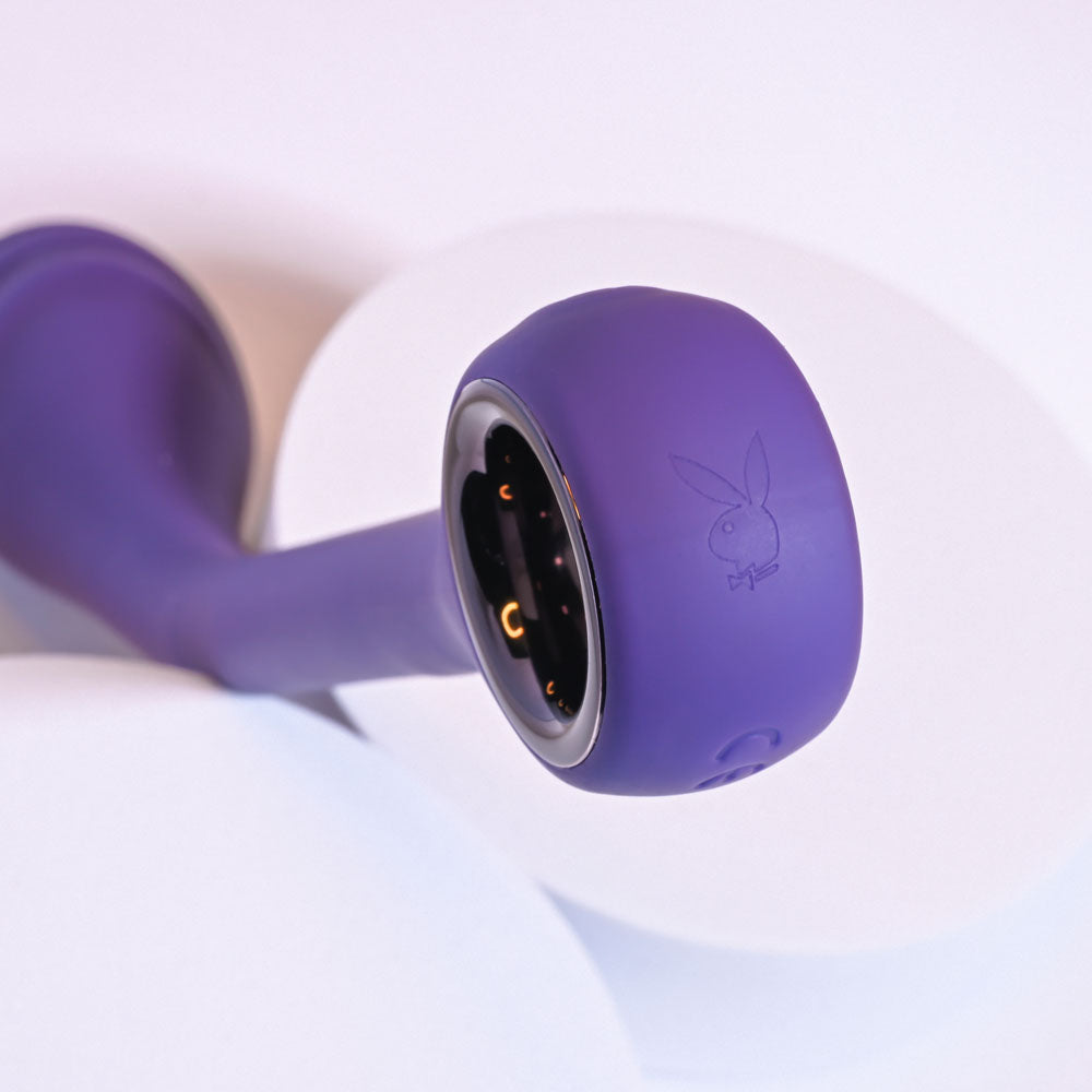 Close-up of a purple Playboy Pleasure SPOT ON poseable G-Spot vibrator with a textured head.