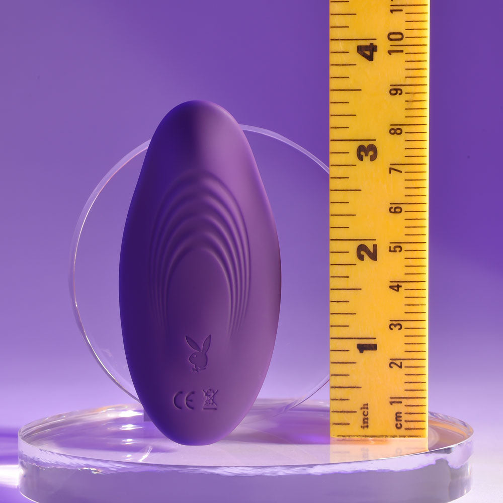 Playboy Pleasure OUR LITTLE SECRET - USB Rechargeable Panty Vibrator with Wireless Remote Control, showcased with a ruler for size comparison.