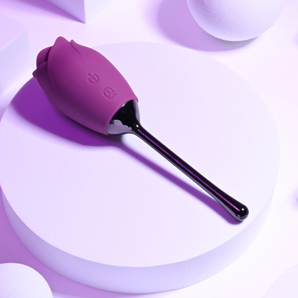 Playboy Pleasure PETAL - USB Rechargeable Flicking Stimulator on a modern display, showcasing its sleek design.
