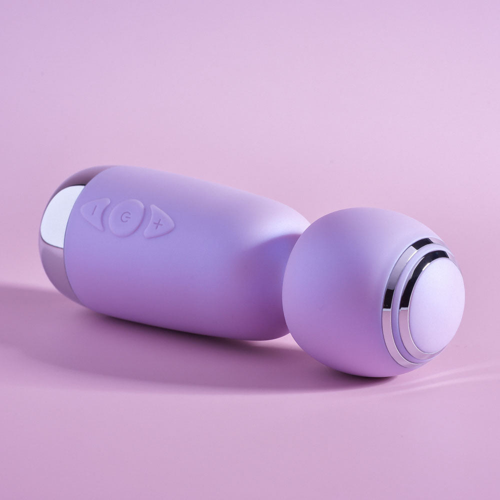 Playboy Pleasure ROYAL MINI - Lilac 12.5 cm USB Rechargeable Mini Wand Vibrator on a pastel background.