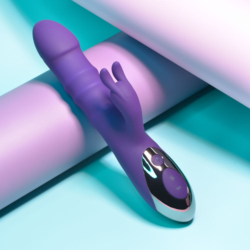 Playboy Pleasure HOP TO IT - 23.5 cm USB Rechargeable Rabbit Vibrator on colorful background.