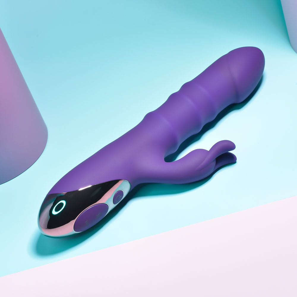 Playboy Pleasure HOP TO IT - 23.5 cm USB Rechargeable Rabbit Vibrator on a pastel background showcasing its sleek design.