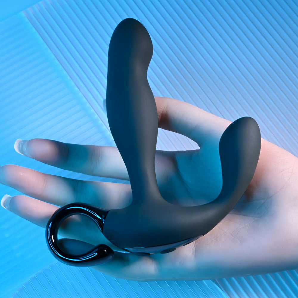 Playboy Pleasure COME HITHER -  13.2 cm USB Rechargeable Vibrating Prostate Massager with Wireless Remote Control in hand.