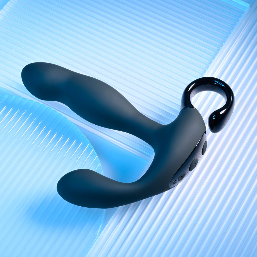 Playboy Pleasure COME HITHER - 13.2 cm USB Rechargeable Vibrating Prostate Massager with Wireless Remote Control on a blue background.