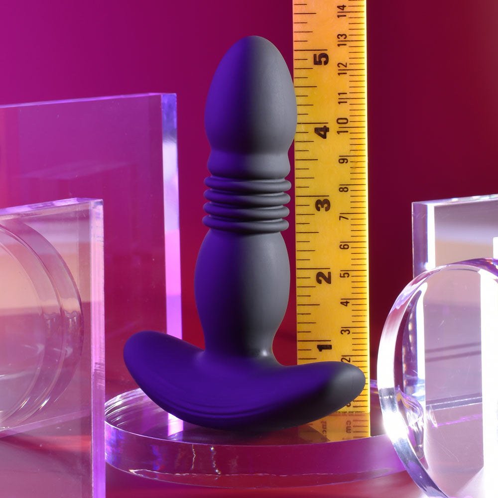 Playboy Pleasure TRUST THE THRUST -  13.7 cm USB Rechargeable Thrusting Butt Plug with Wireless Remote on display.