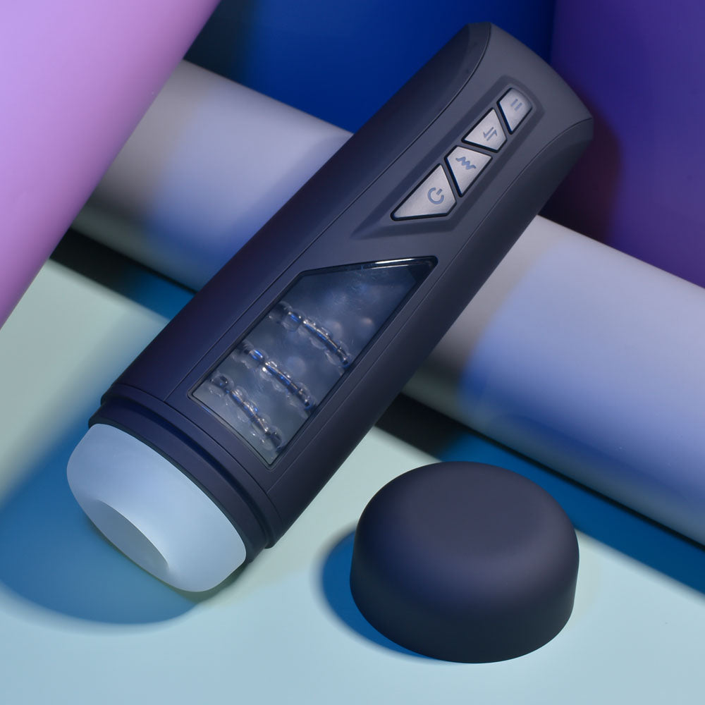 Playboy Pleasure PURSUIT OF PLEASURE - USB Rechargeable Vibrating Stroker on a colorful background.