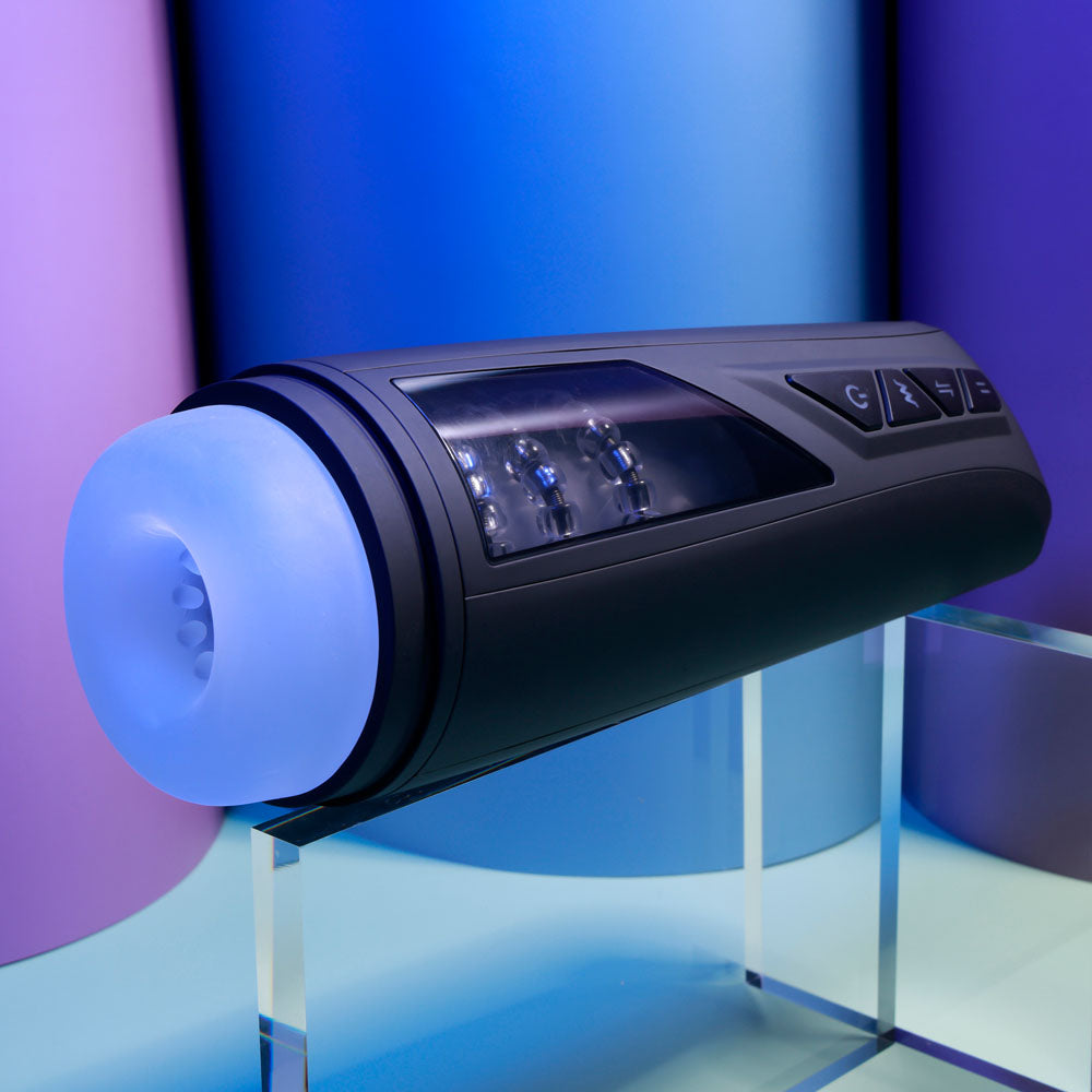Playboy Pleasure PURSUIT OF PLEASURE - USB Rechargeable Vibrating Stroker on display with clear chamber and textured inner channel.