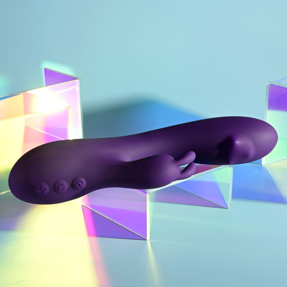 Playboy Pleasure ON REPEAT - 19.7 cm USB Rechargeable Rabbit Vibrator on colorful background.