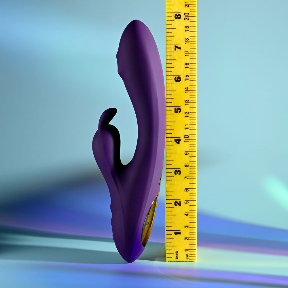 Playboy Pleasure ON REPEAT - 19.7 cm USB Rechargeable Rabbit Vibrator with measuring tape next to it for size reference.
