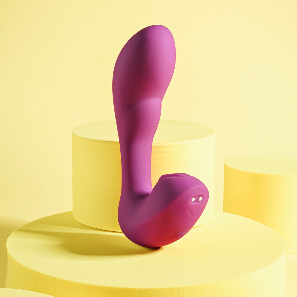 Playboy Pleasure ARCH -  14.1 cm USB Rechargeable G-Spot Vibrator on yellow display background.