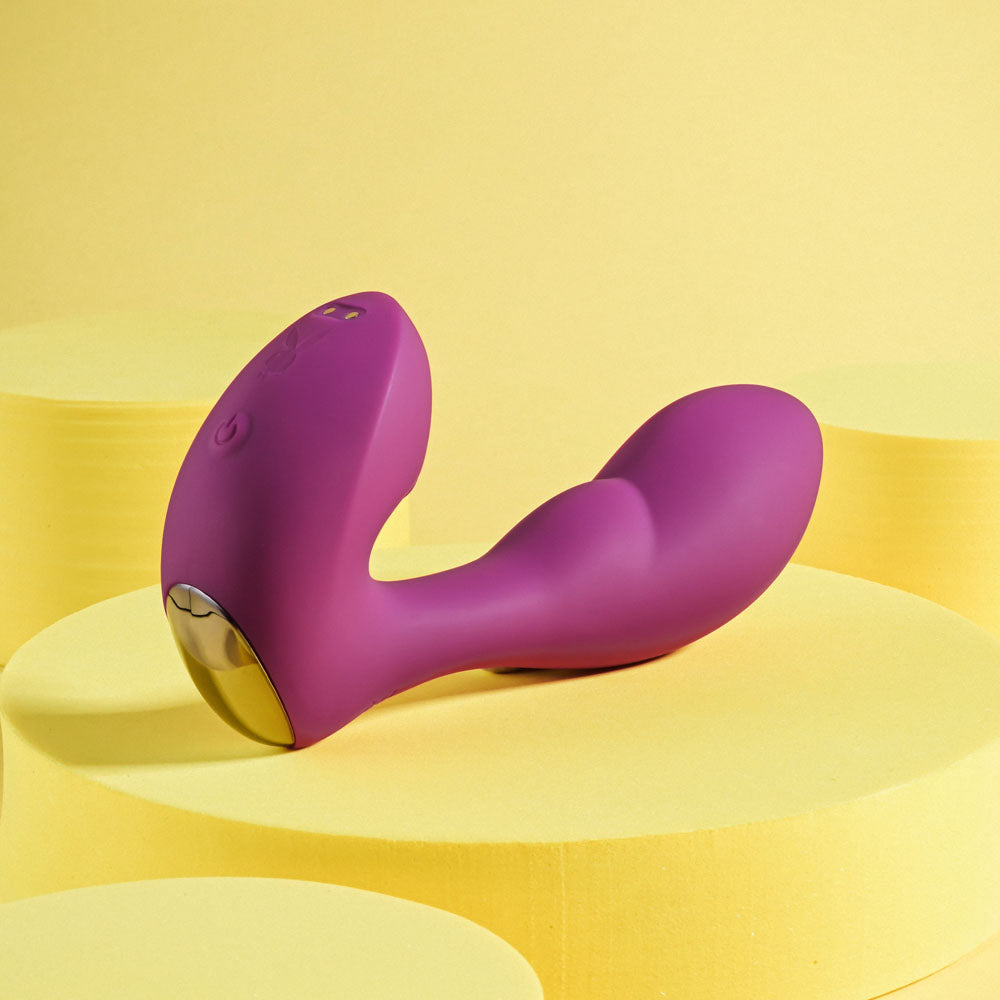 Playboy Pleasure ARCH -  14.1 cm USB Rechargeable G-Spot Vibrator on yellow background.